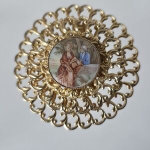 Vintage Gold Tone Filigree Brooch with Porcelain Painted Courting Couple Scene
